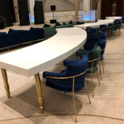 avalon-curved-gold-dining-table-with-green-eleganza-dining-chair-and-blue-eleganza-dining-chair-scaled-e1643886007309